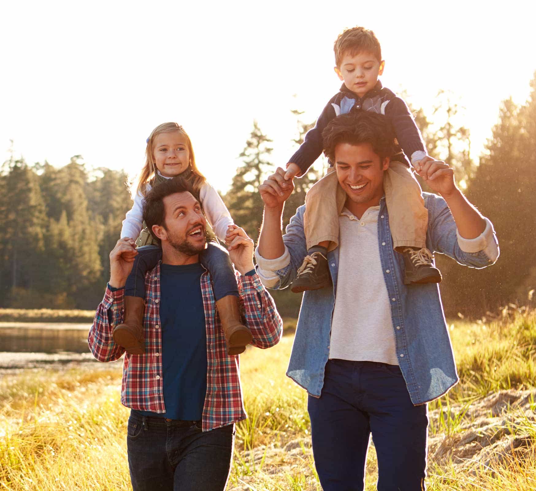 two men hiking with their children